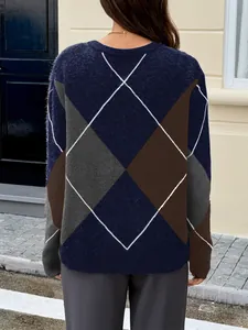 Detailed back view of women's oversized argyle pattern knit sweater in navy and brown