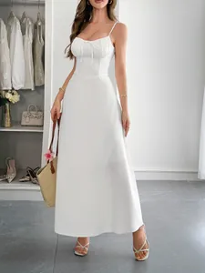 Elegant white spaghetti strap maxi dress with a ruched bodice and cinched waist for summer.