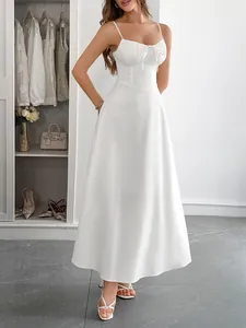 Detail shot of white spaghetti strap midi dress with cinched waist and pleated bust