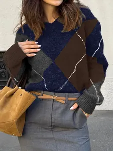 Detail view of women's color-block knit sweater with geometric argyle pattern for autumn