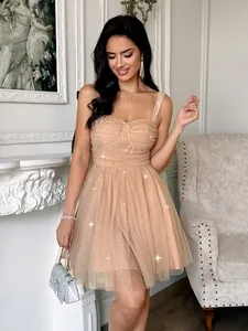 Detailed view of apricot mesh party dress with sparkling sequins and sweetheart neckline