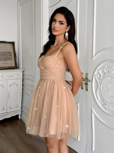 Elegant nude tulle party dress with spaghetti straps and shimmering sequins details