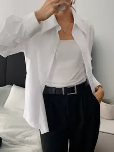 Detailed look at a premium white long-sleeved button-up shirt for a chic casual style.