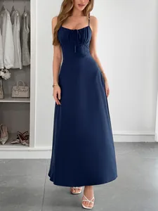 Detail view of navy blue camisole maxi dress featuring a ruched tie-up bust design