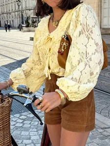 Elegant French vintage yellow lace blouse with floral pattern for a chic summer look