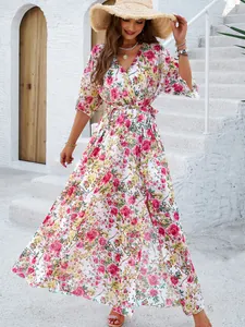 Elegant floral wrap maxi dress with belt detail for a stylish summer vacation look.