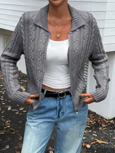 Detailed macro view of a grey cable knit long sleeve cardigan sweater with a stylish zipper
