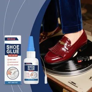 Macro view of fast-drying shoe glue packaging and leather shoe repair scene.