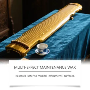 Close-up view of a glossy golden Guqin surface maintained with multi-effect instrument wax.