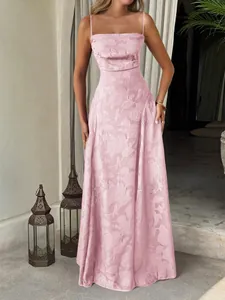 Elegant pink floral jacquard maxi dress with spaghetti straps for a summer resort look.