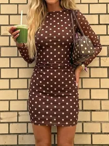 Brown polka dot bodycon mini dress featuring long mesh sleeves and side pleated detail.