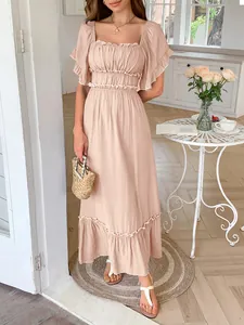 Detailed shot of a peach summer maxi dress featuring ruffle sleeves and a high waist