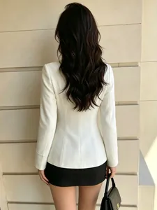 Back view of a slim-fit white blazer showing elegant waist-shaping details and clean lines.