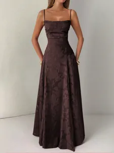Full view of an elegant floral jacquard spaghetti strap maxi dress with a flowing silhouette