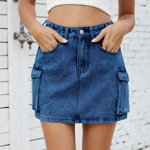 Close-up detail of a vintage washed blue denim cargo mini skirt with flap pockets.