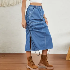 Detailed view of washed denim midi skirt featuring elastic waist and side drawstring