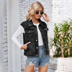Detail shot of a stylish black washed denim vest for women with classic metal buttons