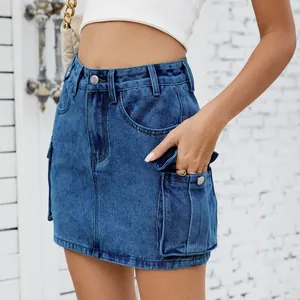 Close-up view of a blue vintage denim cargo mini skirt with functional side pockets