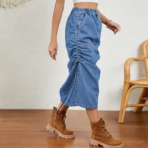 Detailed side view of washed blue denim midi skirt featuring adjustable drawstring ruching