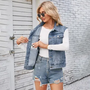 Detail of women's washed denim vest featuring a practical inner pocket for phone storage.