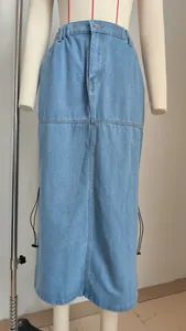 Detailed view of light blue denim midi skirt with elastic waist and side drawstrings