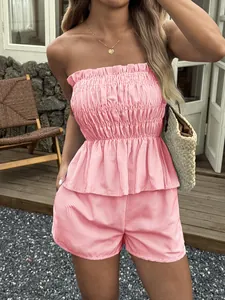 Detailed view of pink striped two-piece summer vacation set with ruffled strapless top