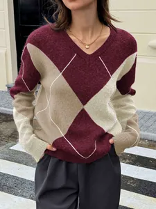 Detail of classic argyle color-block knit texture on a stylish women's V-neck sweater
