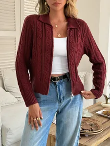 Close-up of a burgundy cable-knit cardigan with zipper detail and lapel collar.