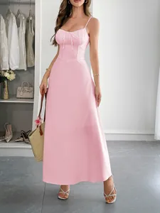 Full length shot of an elegant pink spaghetti strap dress with a corset bodice
