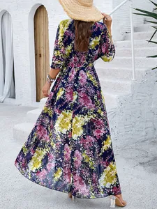 Back view of an elegant navy floral maxi dress with vibrant pink and yellow prints.