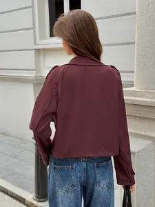Detailed back view of a stylish burgundy long-sleeved women's casual jacket coat for autumn.