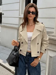 Detailed view of women's khaki cropped trench jacket with double-breasted buttons