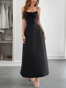 Full-length view of a sophisticated black cami maxi dress with elegant bust tie detail