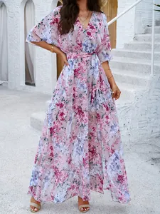 Elegant pink floral maxi dress featuring a V-neck and tie-waist for summer style