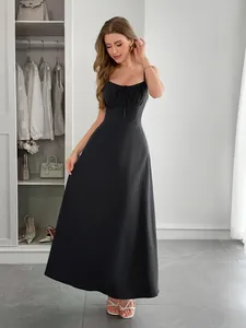 Elegant black vacation maxi dress with spaghetti straps and flattering high waistline.