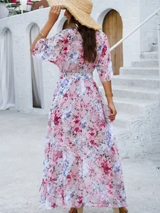 Back view of an elegant pink floral maxi dress for spring and summer beach vacation