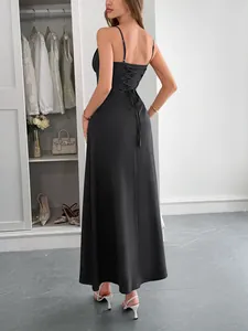 Elegant black spaghetti strap maxi dress featuring a sophisticated lace-up back detail