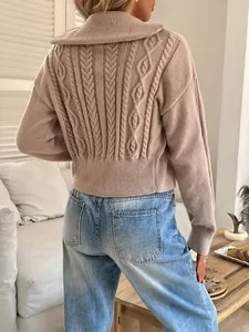 Back view of a French style cable knit sweater featuring a large lapel collar detail