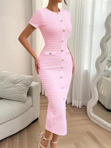 Close-up of a pink button-down slim-fit maxi dress featuring textured knit detail