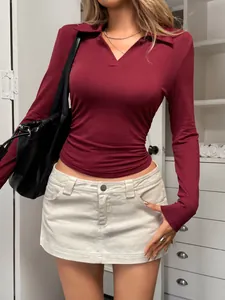 Close-up of elegant burgundy long-sleeved V-neck T-shirt for women stylish autumn winter fashion