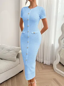 Close-up view of a light blue short sleeve slim fit knit dress with gold buttons