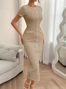 Slim fit beige ribbed maxi dress with decorative buttons and short sleeves in a chic indoor setting