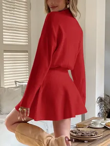 Back view detail of a vibrant red Y2K style long-sleeved knitted mini dress with A-line skirt