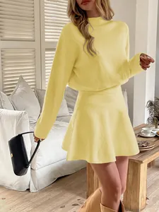 Detailed view of the light yellow long sleeve knit dress set in a cozy home setting