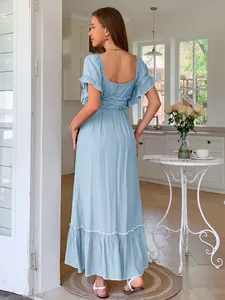 Detailed view of light blue ruffled maxi dress showing the elegant square back design