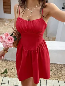 Detail view of a vibrant red French style vacation dress featuring gathered bust and corset waist