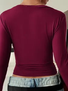 Back view detail of elegant burgundy slim-fit long-sleeve T-shirt for women's autumn style