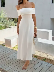 Elegant French style off-shoulder white maxi dress shown in an outdoor lifestyle setting