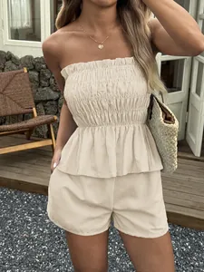 Detailed view of women's beige pinstripe smocked tube top with matching summer shorts