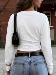 Back view of minimalist white long sleeve T-shirt with elegant side ruched detailing